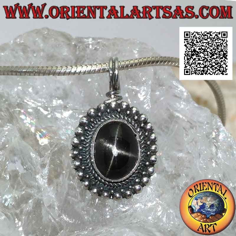 Silver pendant with black star (Diopside) oval cabochon surrounded by weaving and row of smooth balls