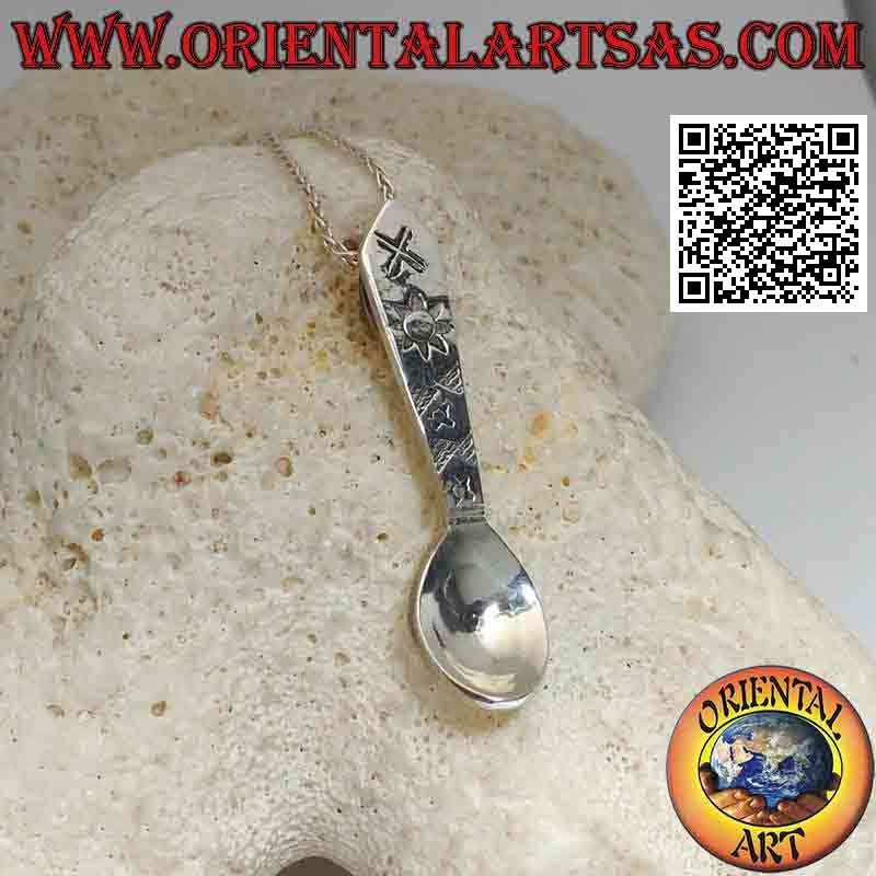 Silver pendant in the shape of a spoon with engraved astral symbols