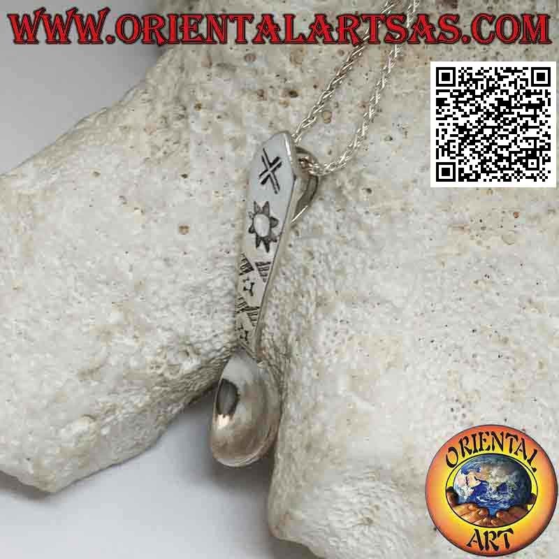 Silver pendant in the shape of a spoon with engraved astral symbols