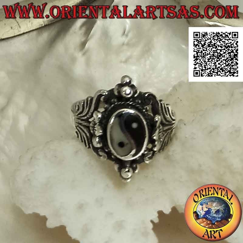 Silver ring with yin yang of onyx and mother of pearl on ethnic setting with floral decorations and balls