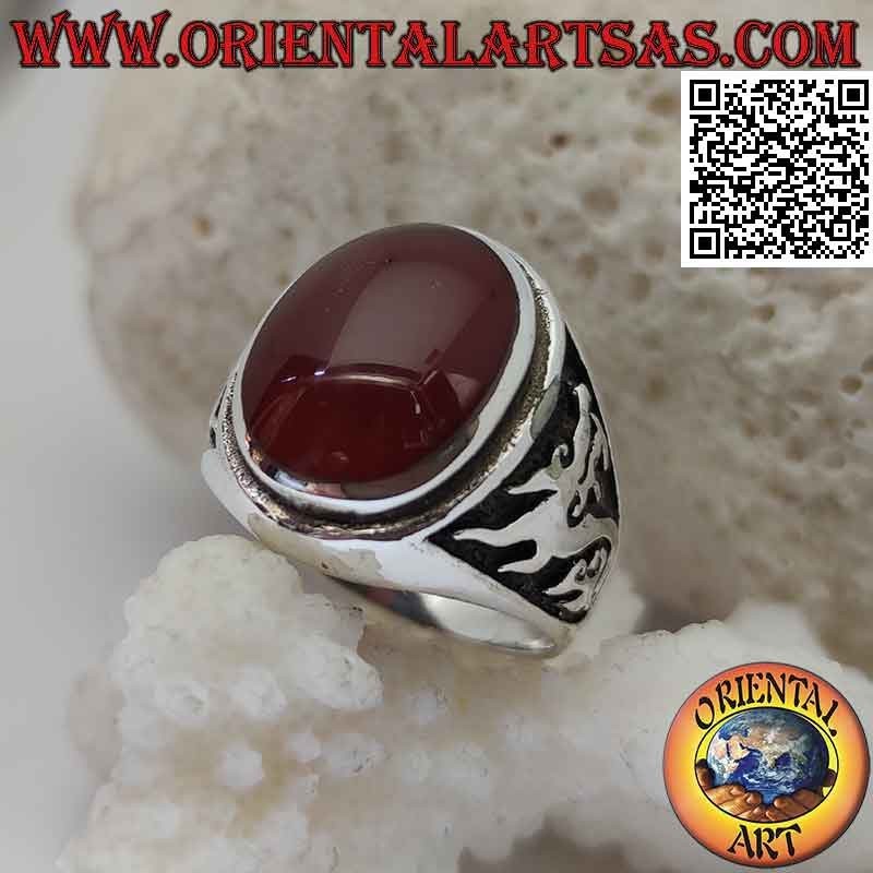 Silver ring with oval carnelian and dragon in high relief on the sides