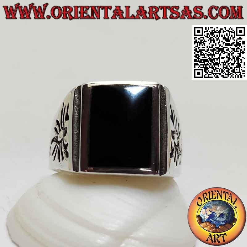 Silver ring with rectangular flush onyx and scorpion engraved on the sides