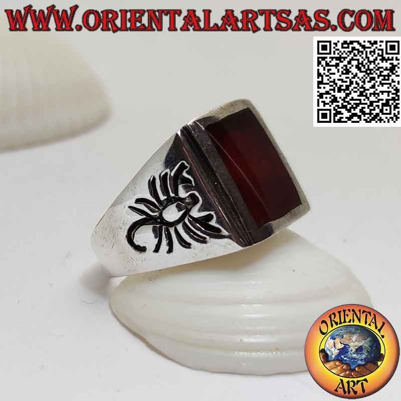 Silver ring with rectangular flush carnelian and scorpion engraved on the sides