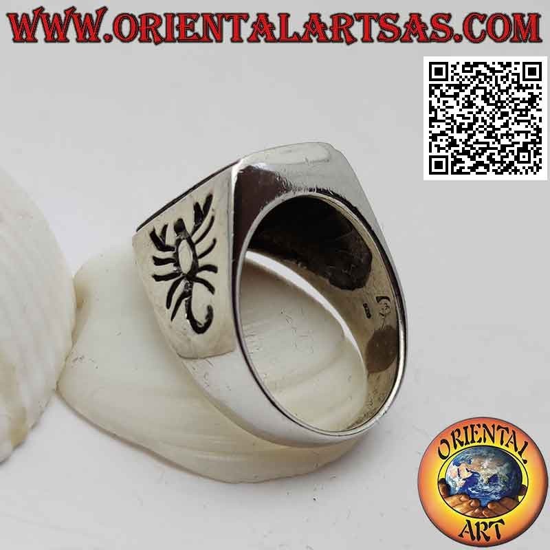 Silver ring with rectangular flush carnelian and scorpion engraved on the sides