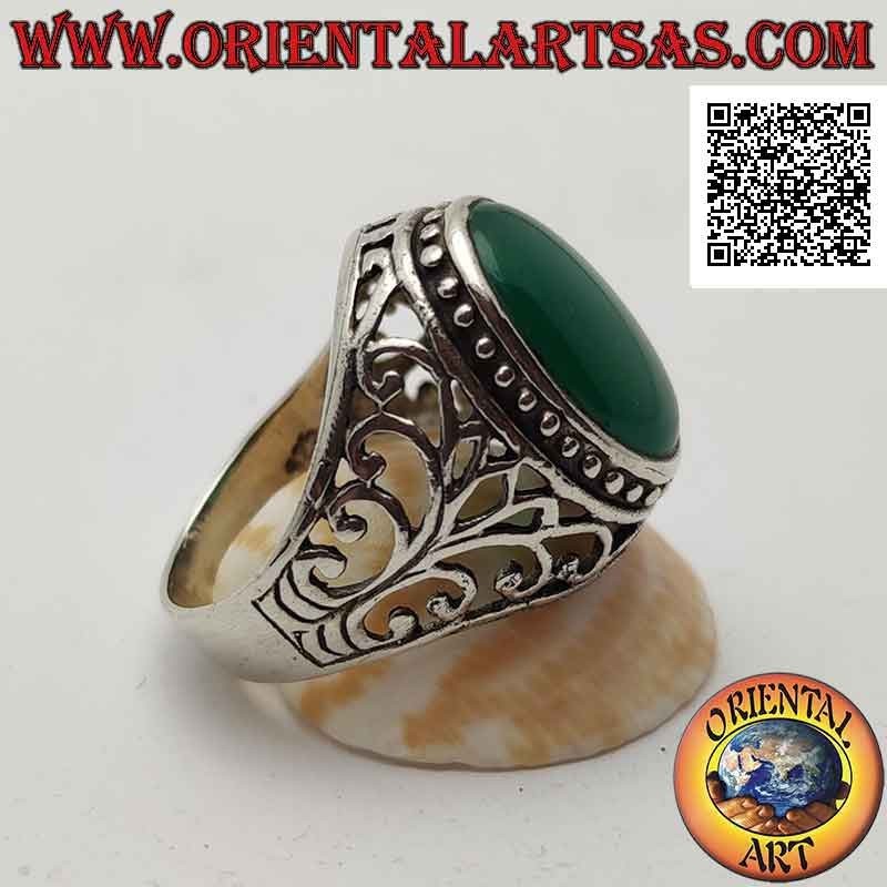 Silver ring with cabochon oval green agate surrounded by dots and openwork baroque decoration on the sides
