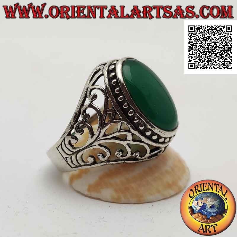 Silver ring with cabochon oval green agate surrounded by dots and openwork baroque decoration on the sides