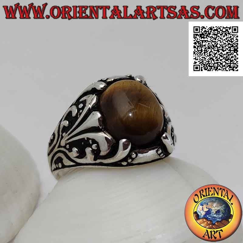 Silver ring with cabochon oval tiger eye set with floral decoration with lily on the sides