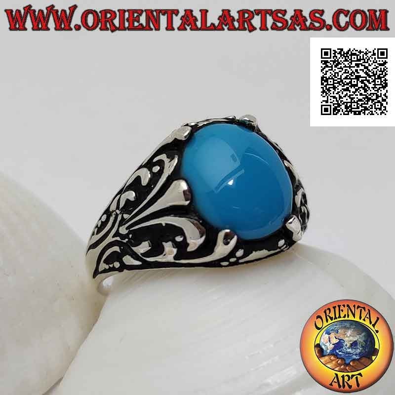 Silver ring with oval cabochon turquoise set with floral decoration with lily on the sides