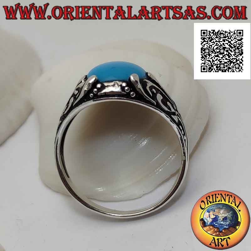 Bague en argent avec cabochon ovale turquoise sertie d'un décor floral avec lys sur les côtés