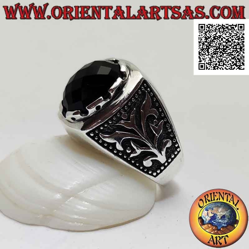 Silver ring with oval cabochon faceted onyx set and climbing plant in bas-relief on the sides