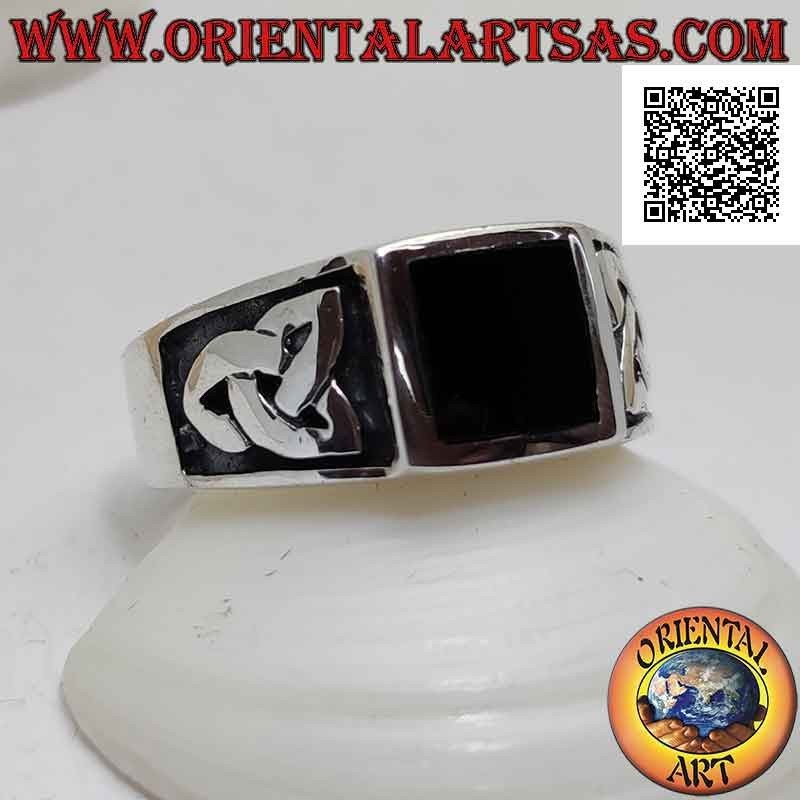 Silver ring with square onyx flush with the edge and bas-relief triquetra on the sides