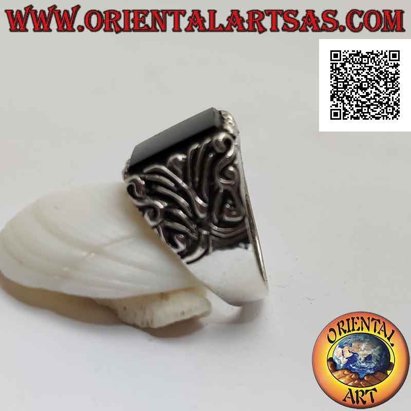 Solid silver ring with flat protruding square onyx and floral decorations engraved on the sides