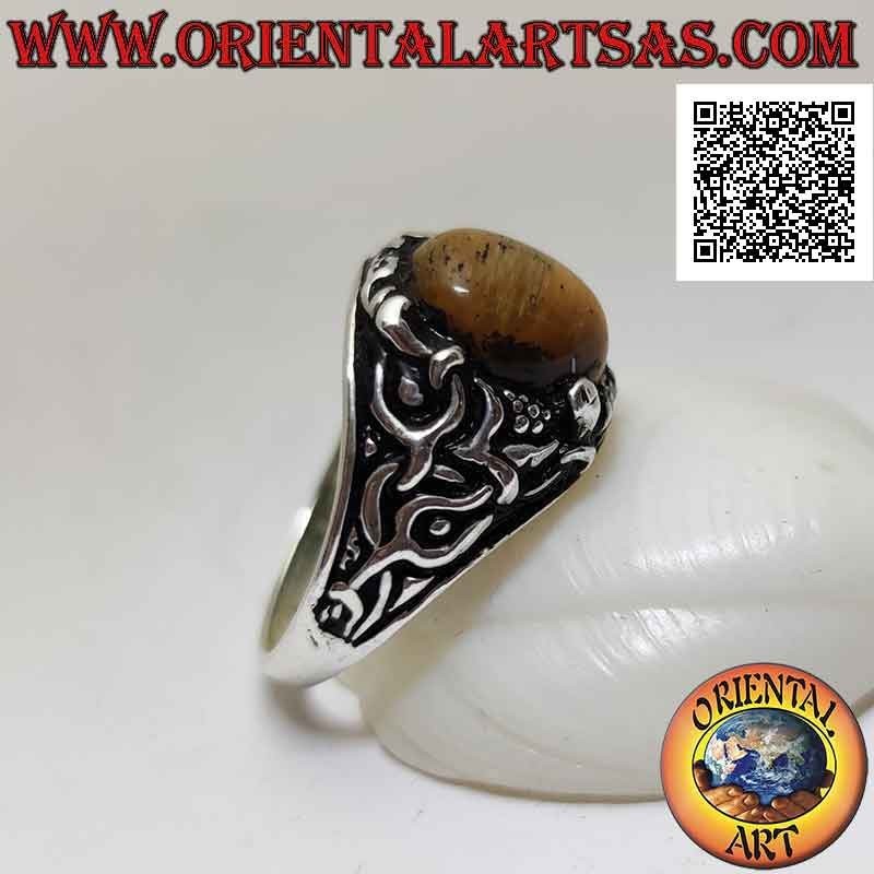 Silver ring with cabochon oval tiger eye set with floral decoration on the sides