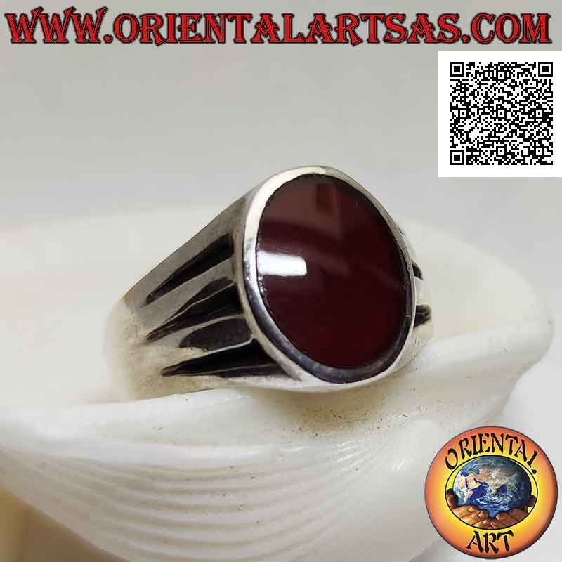 Smooth silver ring with oval carnelian flush with the edge and triple crescent horizontal line engraved on the sides