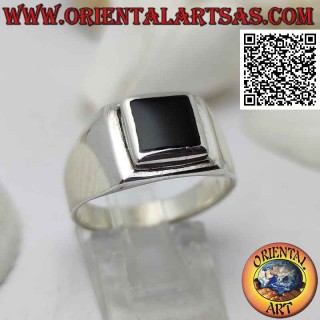 Smooth silver ring with square onyx set flush with the edge on a raised square