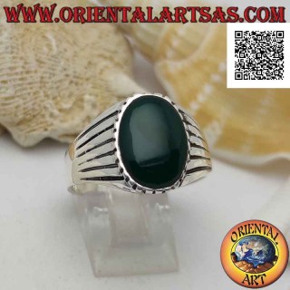 Silver ring with oval green agate and edge and side lined with parallel engravings