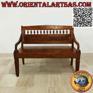 Antique bench with hand-carved flowers in teak wood