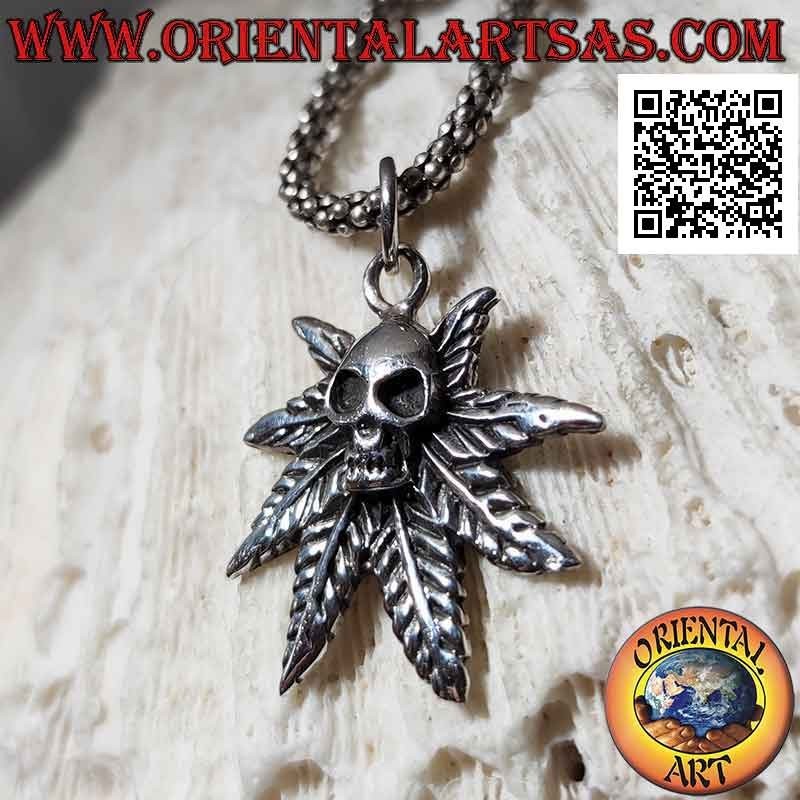 Silver pendant, skull on marijuana leaf
