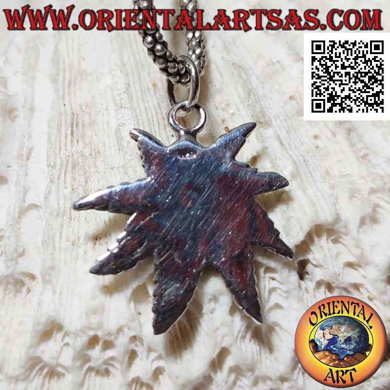 Silver pendant, skull on marijuana leaf