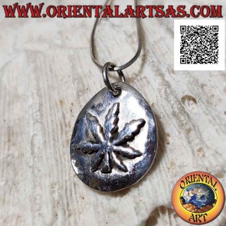 Smooth medal silver pendant with high relief marijuana leaf welded on top