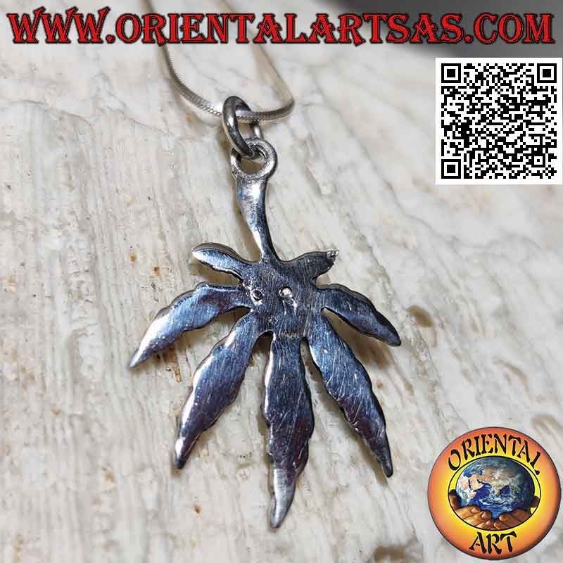 Silver pendant in the shape of a marijuana leaf engraved in bas-relief