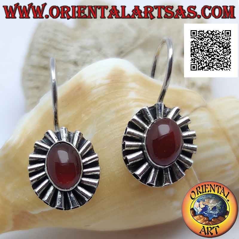 Silver earrings with oval cabochon carnelian surrounded by undulated silver ribbon