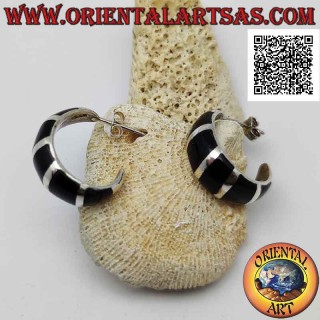 Silver earrings from lobe to circle with increasing thickness and alternating smooth and onyx bands