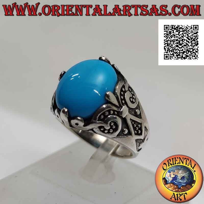 Anello in argento con turchese ovale cabochon incastonato a 4 con decorazione a giglio sui lati