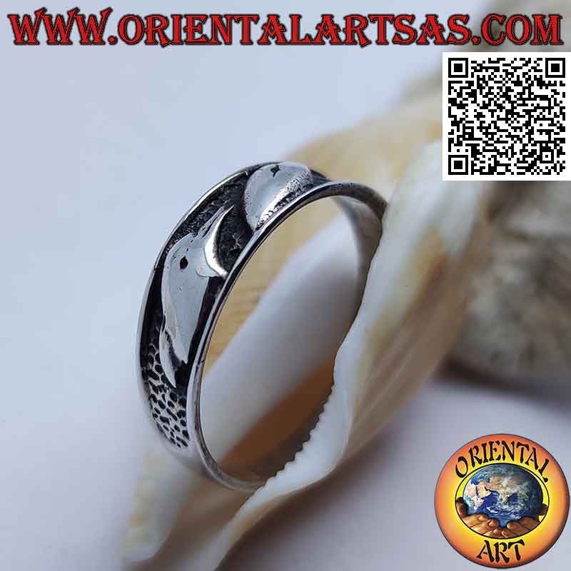Silver ring with bas-relief busts of dolphins