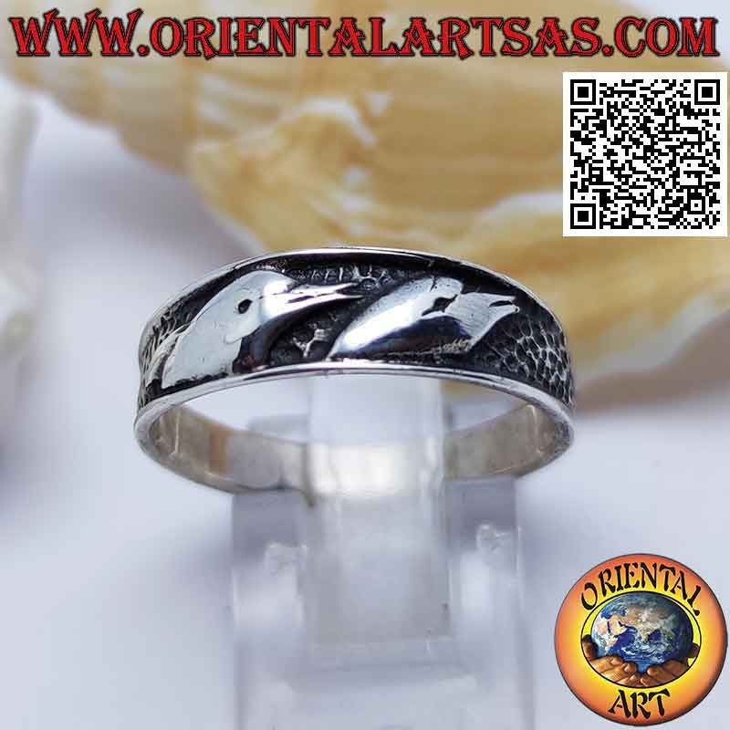 Silver ring with bas-relief busts of dolphins