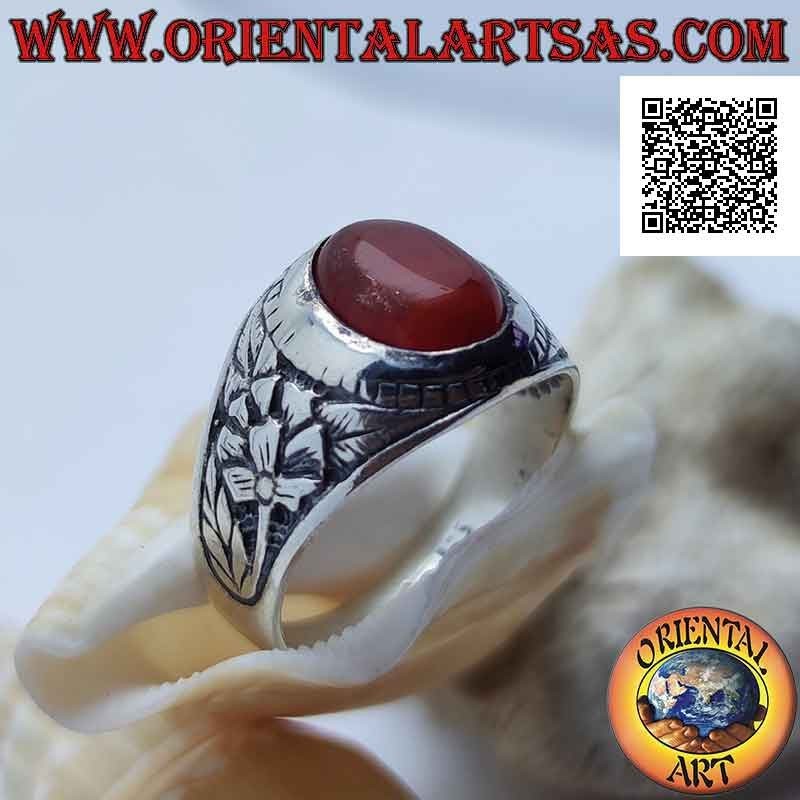 Silver ring with cabochon oval carnelian and rebirth flower in bas-relief on the sides