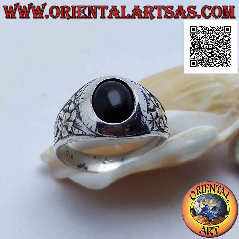 Silver ring with oval cabochon onyx and flower of rebirth in bas-relief on the sides