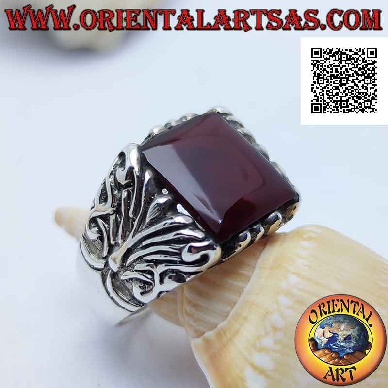 Silver ring with square carnelian surrounded by baroque engravings on an imposing setting