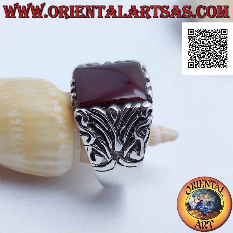 Silver ring with square carnelian surrounded by baroque engravings on an imposing setting