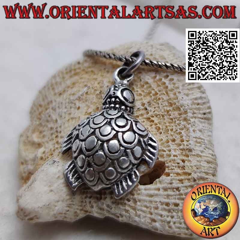 Silver pendant in the shape of an engraved and shaped sea turtle
