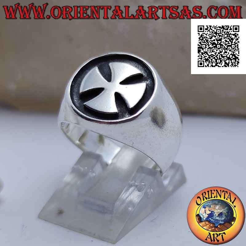 Smooth silver ring with smooth Maltese cross on a dark bas-relief background