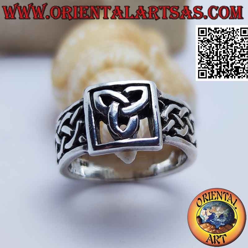 Silver ring with openwork triquetra in the square and Celtic interlacing on the sides