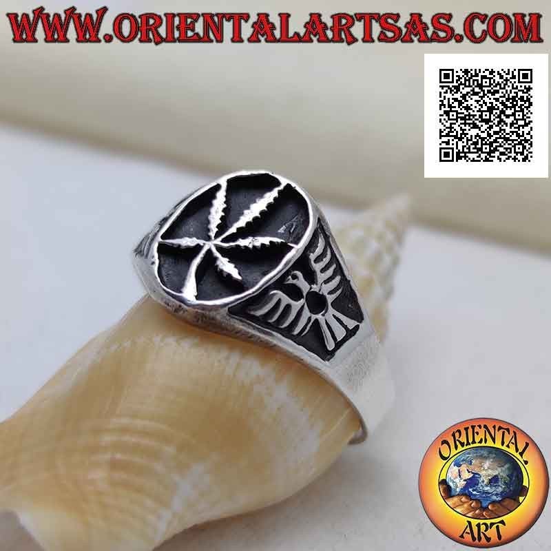 Anillo de plata con hoja de marihuana en el óvalo en bajorrelieve y águila en los laterales