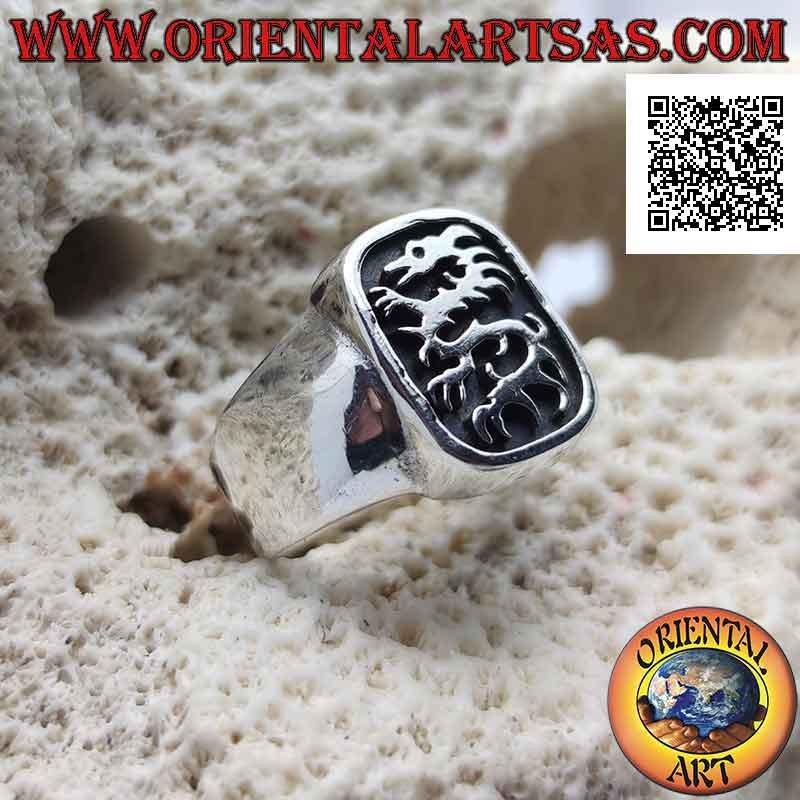 Smooth silver ring with lindworm (dragon) in the curved rectangle in bas-relief
