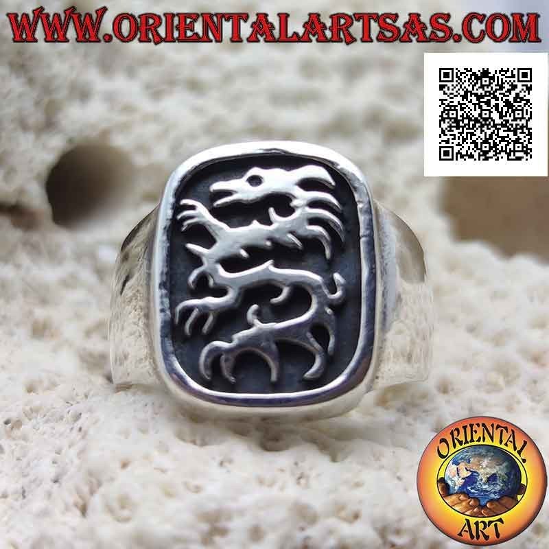 Smooth silver ring with lindworm (dragon) in the curved rectangle in bas-relief