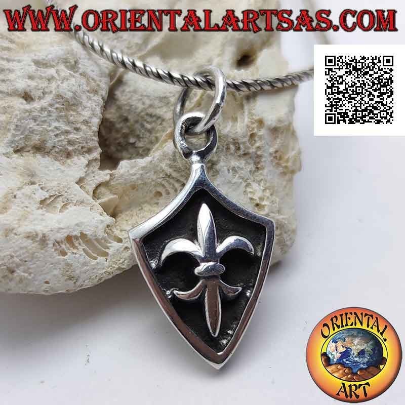 Silver pendant, rhomboid shield with lily in high relief on a darkened background