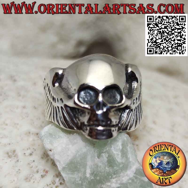 Silver ring in the shape of a skull without eyes and with wings on the sides