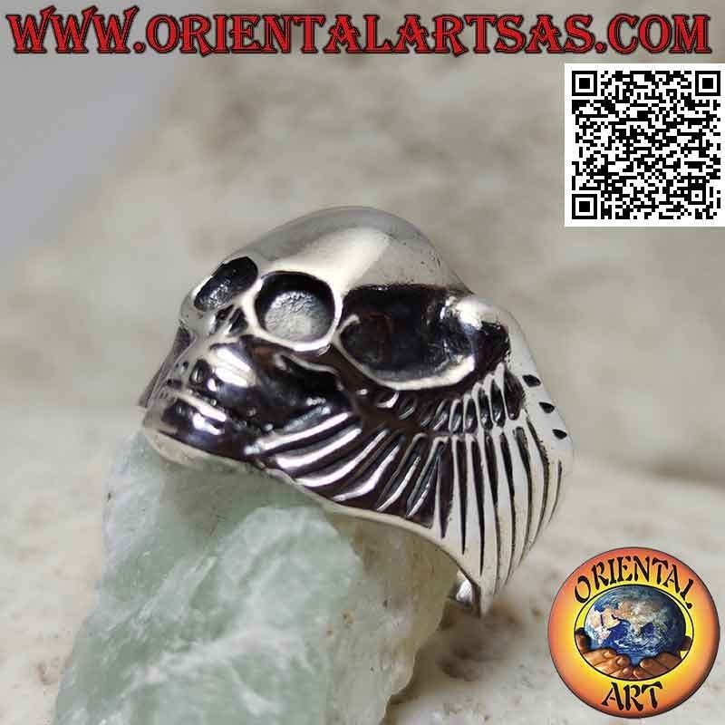 Silver ring in the shape of a skull without eyes and with wings on the sides