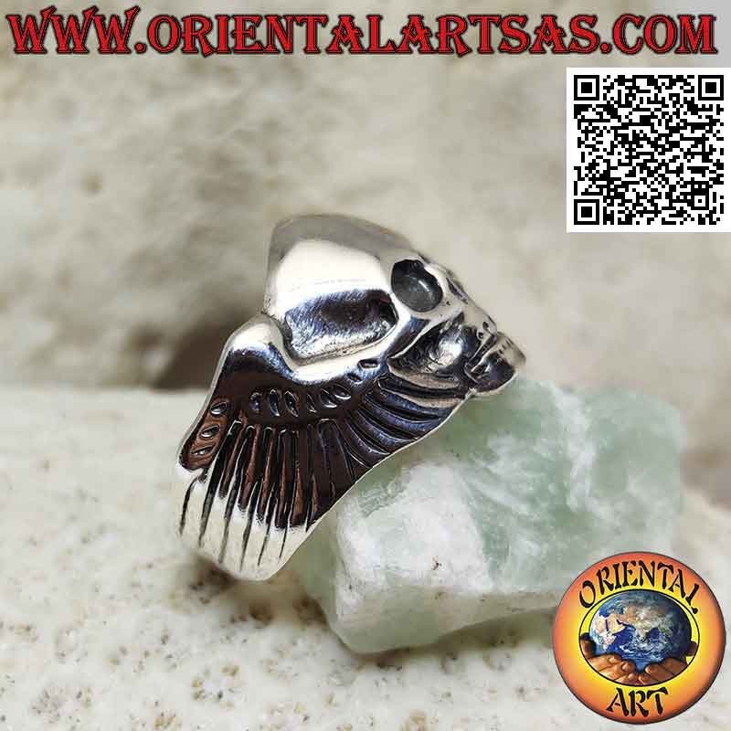 Silver ring in the shape of a skull without eyes and with wings on the sides