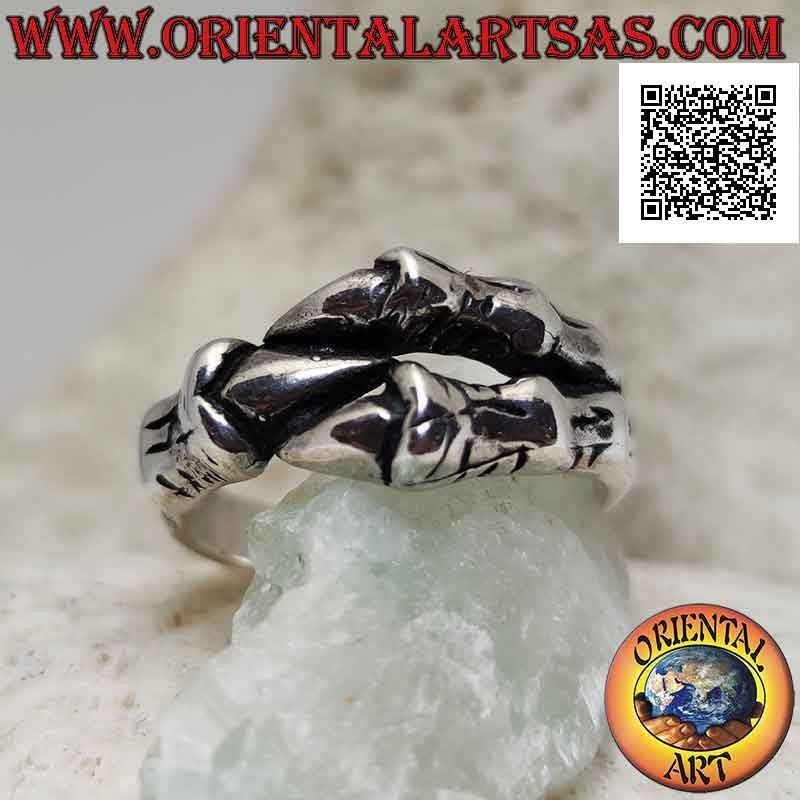 Silver ring in the shape of three dragon claws enveloping in a strong grip