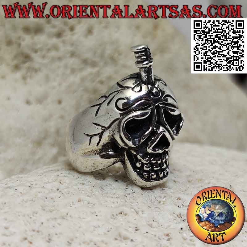 Silver ring in the shape of a suffering skull with a sword stuck in the skull