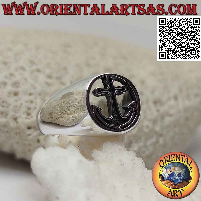Smooth silver ring with bas-relief anchor in the pierced circle