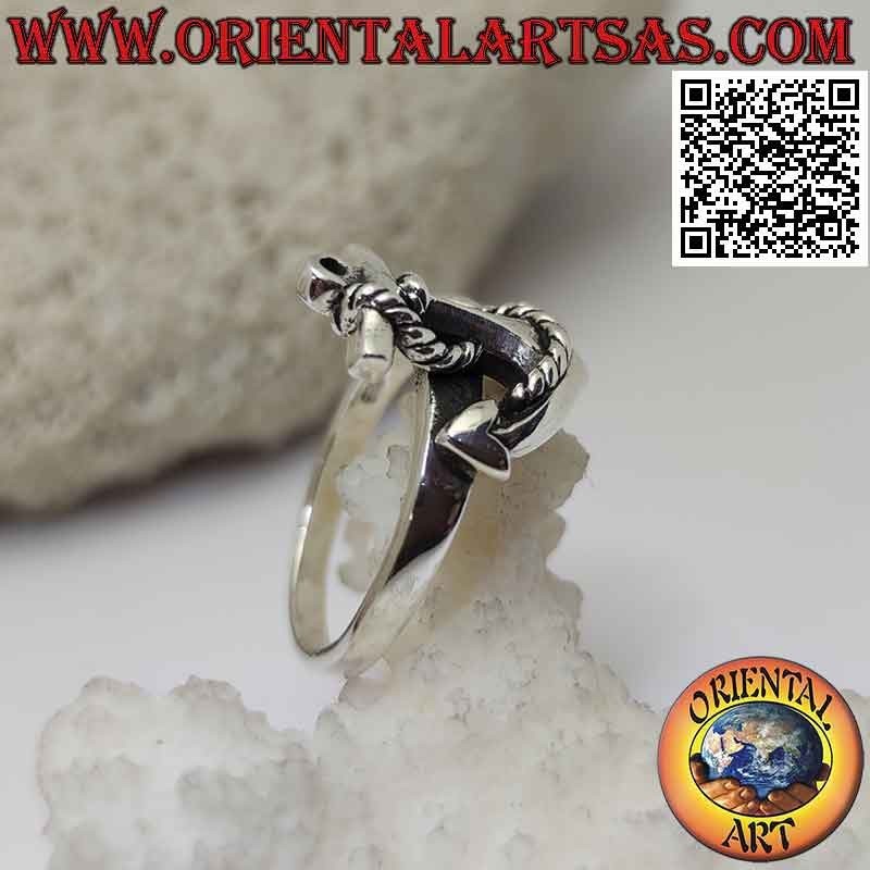 Silver ring in the shape of an anchor and rope