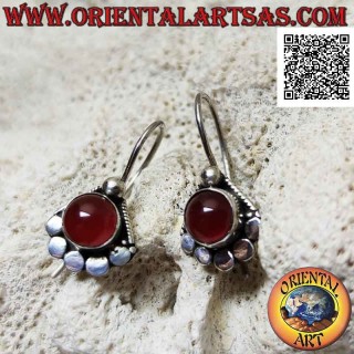 Silver earrings with round cabochon carnelian surrounded by studs below and ball above