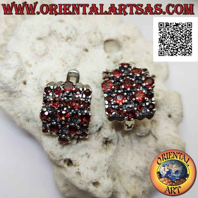 Silver earrings, curved rectangle and rhombus overlaid with small and large round garnets